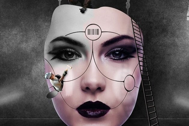 A face of a female robot being shaped and painted by artists.