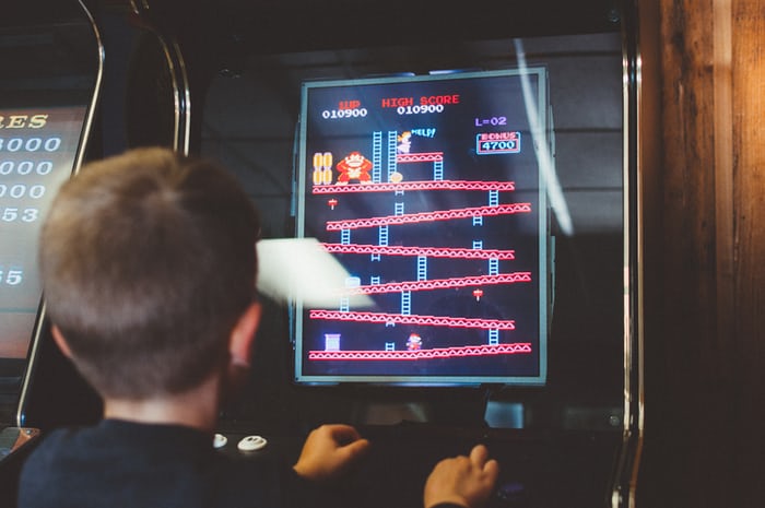 A boy playing monkey game on computer