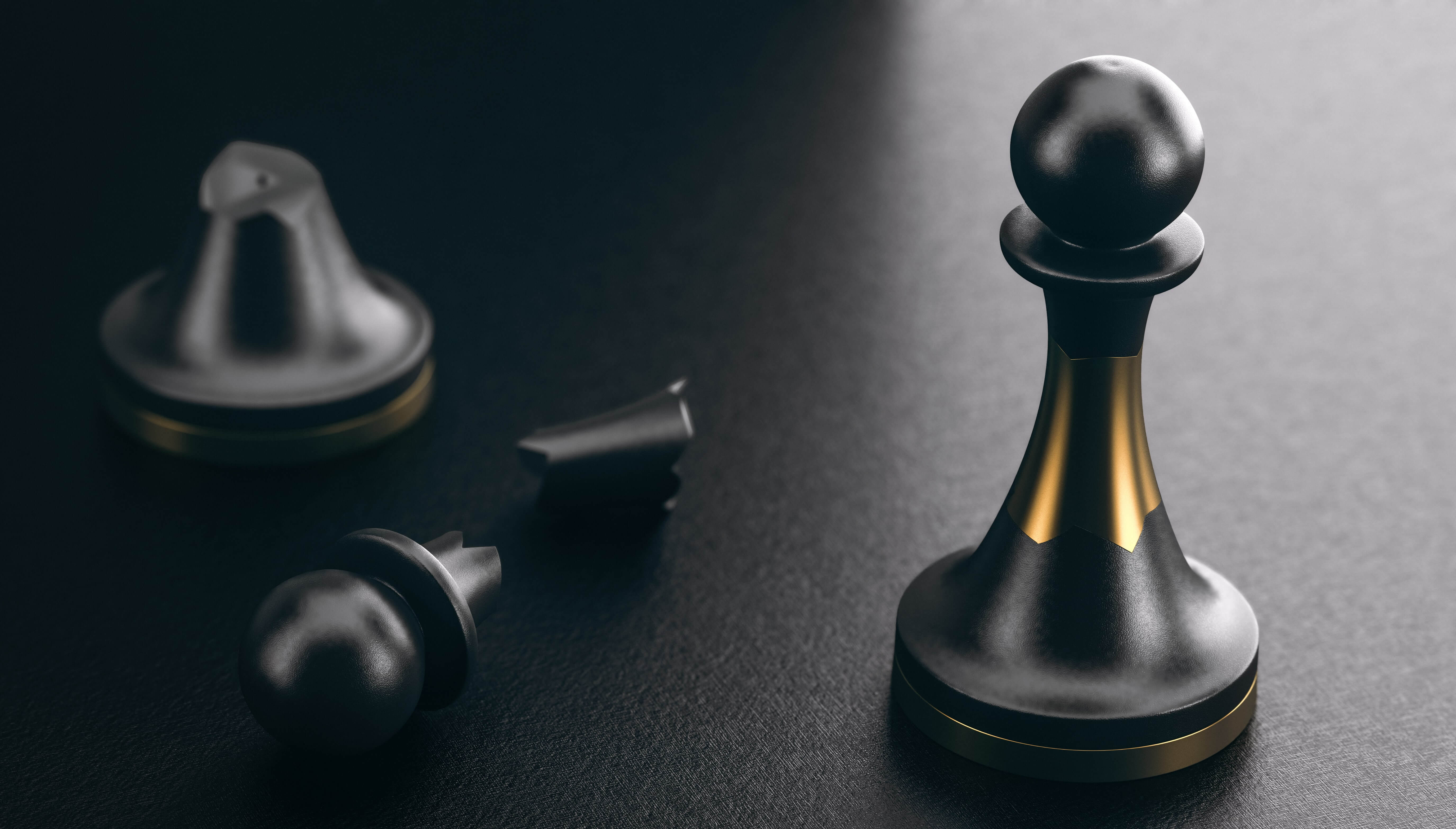 A broken chess piece and a fine chess piece kept on a black surface